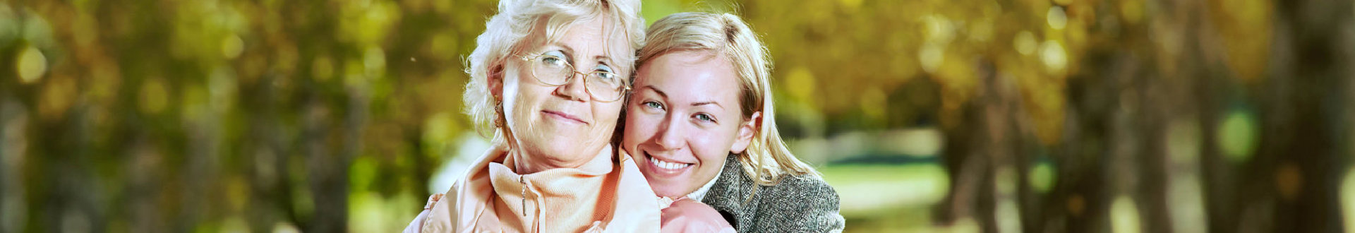 happy senior woman and caregiver